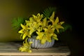 A beautiful bouquet of lilies on a brown-green background