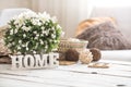 Still life in the living room with wooden inscription home Royalty Free Stock Photo