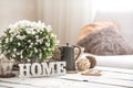 Still life in the living room with wooden inscription home Royalty Free Stock Photo