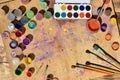 Still life with a lot of brushes and jars of watercolor and gouache paint Royalty Free Stock Photo