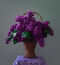 Still life lush bouquet of lilacs in a basket