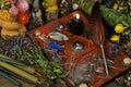 Still life with magic book, black candle, quill, herbs and elixir on witch table