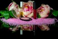 Still life make up accessories and flowers on reflective surface. Royalty Free Stock Photo
