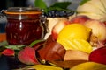 Still life with melon, nectarines, jam and autumn leaves. Autumn harvest season. Fresh delicious healthy fruits, contain Royalty Free Stock Photo