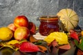 Still life with melon, nectarines, jam and autumn leaves. Autumn harvest season. Fresh delicious healthy fruits, contain Royalty Free Stock Photo