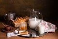 Still life with milk, honey bread and a coffee pot on a table Royalty Free Stock Photo