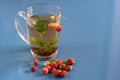 Still life of a mug of herbal tea on blue ceramic tiles with dust texture. With space for text. Royalty Free Stock Photo