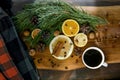 Still-life New Year, Christmas - a cup of coffee, tangerines, lemons, walnuts, pine branches, cinnamon Royalty Free Stock Photo