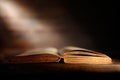 Old book with open pages and ray of light Royalty Free Stock Photo