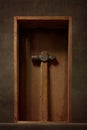 Still life with an old hammer in a wooden box Royalty Free Stock Photo
