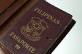 A still life of a old hole-ridden philippine passport Royalty Free Stock Photo