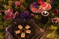 Still life with old runes, zodiac circle, black candle, flowers and ritual objects Royalty Free Stock Photo