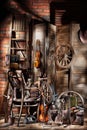 Still Life With Old Spinning Wheel, Violins And Ladder Royalty Free Stock Photo