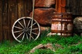 Still-life with an old wheel and barrel Royalty Free Stock Photo