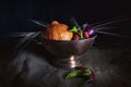 Still life. Orange pumpkin, red and green chilli peppers, purple onions, and dried wheat rings in a metal cup Royalty Free Stock Photo