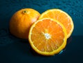 Still life Orange slice fruit on dark blue background. mandarins