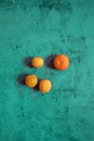 Still Life oranges composition in a blue stone background Royalty Free Stock Photo