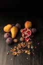 still life with organic autumnal fruits and walnuts