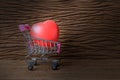 Still life painting photography with red heart shape over old beautiful wooden background. Image for love shopping concept. Royalty Free Stock Photo