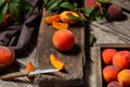 Still life peach on cutting board with knife in dark key. Juicy ripe peaches on dark wooden rustic table. Delicious farm peaches Royalty Free Stock Photo