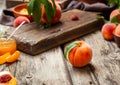 Still life peaches on wooden table with cutting board knife in dark key. Juicy ripe peaches on dark wooden rustic table Royalty Free Stock Photo