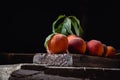 Still life peaches on wooden table cutting board knife Dark mood. Juicy ripe peaches on dark wooden rustic table. Delicious farm Royalty Free Stock Photo