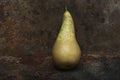 Still life pear- rusty metal background Royalty Free Stock Photo