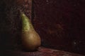 Still life pear- rusty metal background Royalty Free Stock Photo