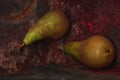 Still life pear- rusty metal background Royalty Free Stock Photo