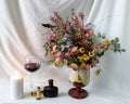 still life photo with beautiful dry colorful flowers in a vase, cosmetic accessories Royalty Free Stock Photo