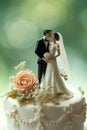 still life photo close-up of the elegant bride and groom miniature on the wedding cake Royalty Free Stock Photo