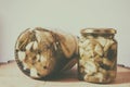 Still life photo, jars under courgette oil with various spices, long life Royalty Free Stock Photo