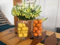 A still-life photo of oranges, lemons and flowers Royalty Free Stock Photo