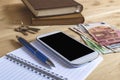 Still life photo of smartphone, notebook, book, pencil, money Royalty Free Stock Photo