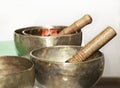 Still life photo with tibet singing bowls close up. Tibetian singing bowls in light blurry background.Asian music instruments. Med Royalty Free Stock Photo