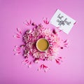 Card with inscription but first coffee, coffee in a cup with chrysanthemum flowers around it.