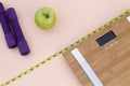 Still Life photography with a green apple, weight tape measure and a scale Royalty Free Stock Photo