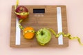 Still Life photography with fruits, tape mesaure and a scale Royalty Free Stock Photo