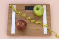 Still Life photography with two apples, tape mesaure and a scale Royalty Free Stock Photo