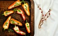 Still life photography with mini bell peppers and goat cheese on a tray Royalty Free Stock Photo