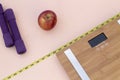 Still Life photography with a red apple, weight tape measure and a scale Royalty Free Stock Photo