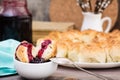 Still life with pieces of monkey bread and berries jam on a wooden table Royalty Free Stock Photo