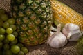 Still Life - Pineapple, Corn, Grapes and Garlic Royalty Free Stock Photo