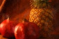 Still life of a pinepple with two pomegranates Royalty Free Stock Photo