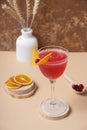 Still life from pink alcoholic cocktail in steamed glasse on wooden podium or pedestal