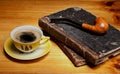 Still life with pipe candle and cup of coffee