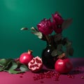 Still life with pomegranate and peonies on a green background Royalty Free Stock Photo