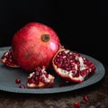 Still life with pomegranate on a platter  square Royalty Free Stock Photo