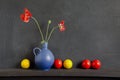 Still-life with poppy and colorful balls