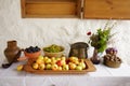 Still-life pottery grapes and fruit on a stone background Royalty Free Stock Photo